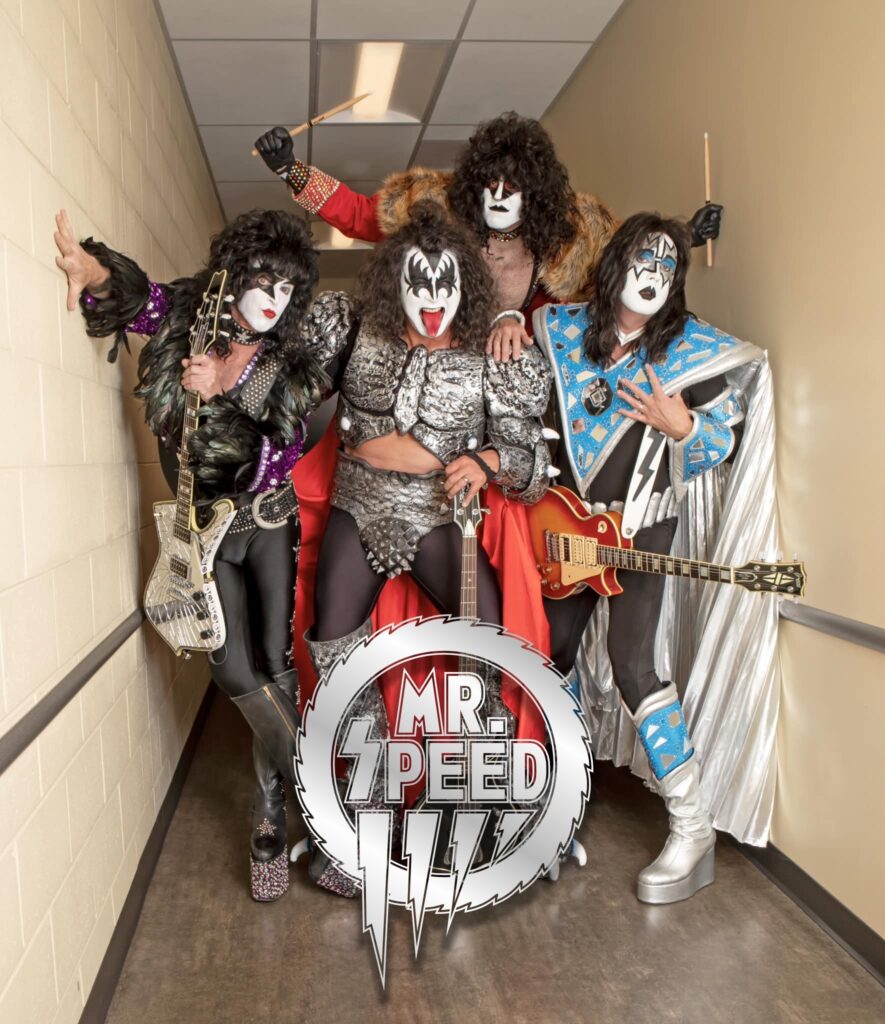A group of men dressed as kiss in costumes.