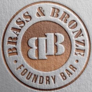 A close up of the logo for brass and bronze.