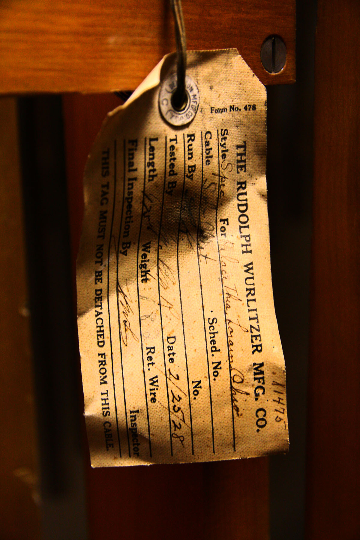 A close up of an old paper tag