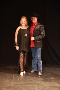 A man and woman posing for the camera.