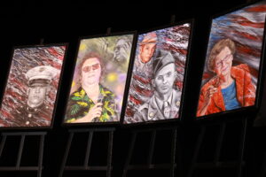 A group of four paintings hanging on the wall.