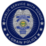 A police badge with the words public service with honor and the name of the officer.